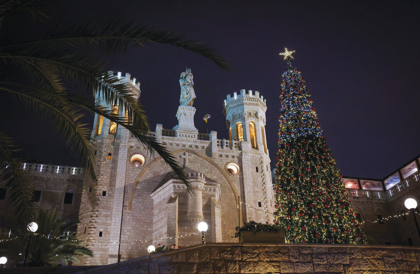 A large Christmas tree adorns the promenade at the Notre Dame Center outside Jerusalem’s Old City. (photo credit: NATI SHOHAT/FLASH90)