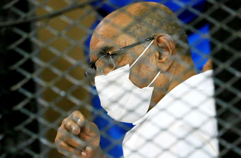  Sudan's ousted president, Omar al-Bashir, is seen inside the defendant's cage at a courthouse in Khartoum on September 15, 2020 (credit: MOHAMED NURELDIN ABDALLAH/REUTERS)