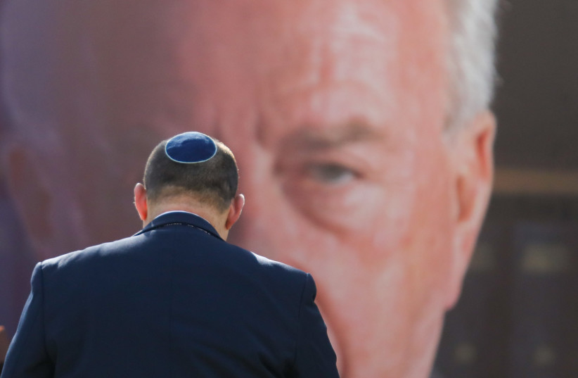  Prime Minister Naftali Bennett under watchful eyes at the annual Yitzhak Rabin memorial ceremony on Mt. Herzl. (credit: MARC ISRAEL SELLEM)