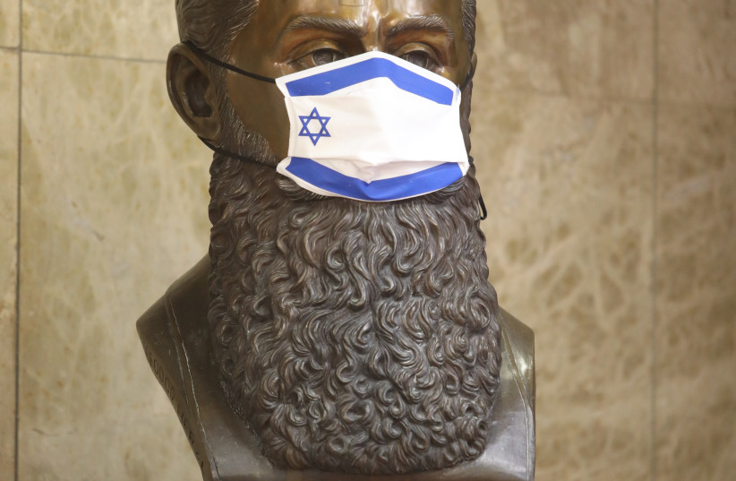  A statue of Theodore Herzl wears a face mask with the Israeli flag on the front (credit: MARC ISRAEL SELLEM)