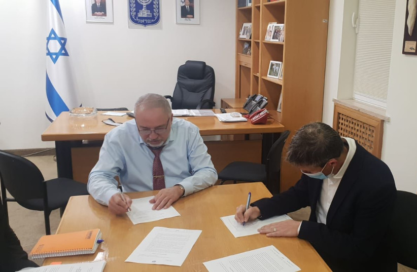  Finance Minister Avigdor Liberman (L) is seen with Communications Minister Yoaz Hendel. The two have agreed upon a format to privatize the Israeli Post Company. (photo credit: COMMUNICATIONS MINISTRY)