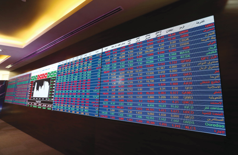  Displaying data at the Doha Stock Exchange in Qatar, January 2021 (credit: REUTERS/IBRAHEEM AL OMARI)