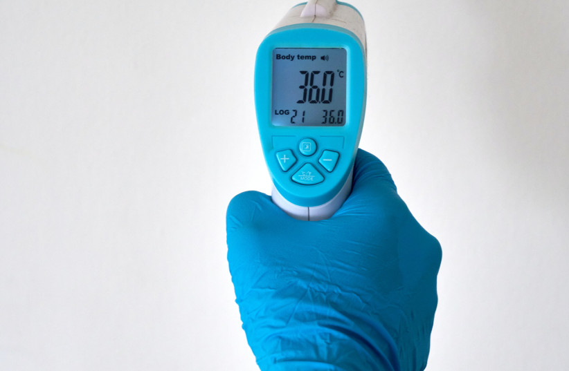  An infrared thermometer, used to detect if someone has a fever (photo credit: UNSPLASH)