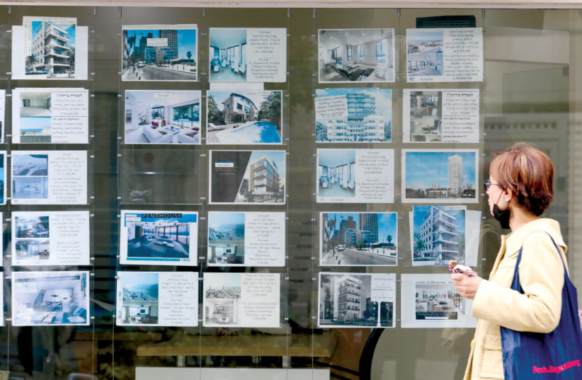  SCENES FROM Tel Aviv: Checking out apartment prices. (photo credit: MARC ISRAEL SELLEM/THE JERUSALEM POST)