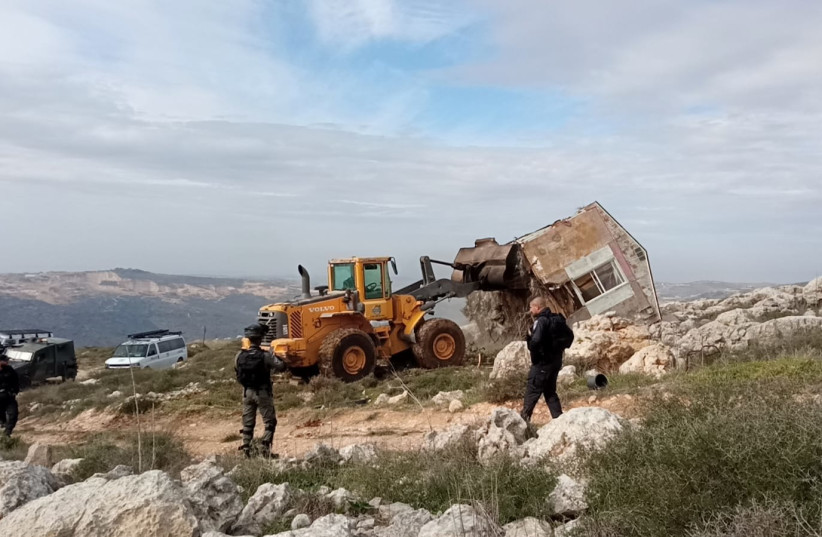  A caravan in Kumi Ori built on IDF land is demolished on Decmber 31, 2021. (credit: ELAZAR RIGER)