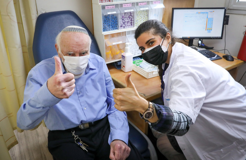   Israelis receiving their fourth coronavirus vaccine, January 3, 2022. (photo credit: MARC ISRAEL SELLEM/THE JERUSALEM POST)