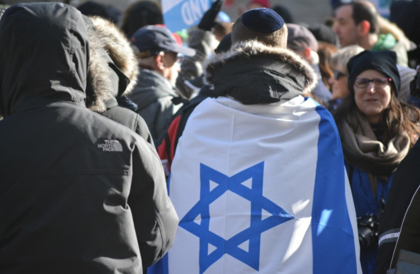  Man wearing the Israeli flag (photo credit: Shutterstock / Hananya Naftali)