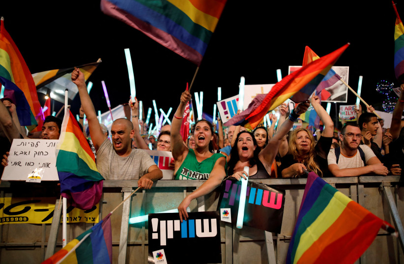   Protesters take part in a LGBT community members protest against discriminatory surrogate bill in Rabin Square in Tel Aviv, Israel, July 22, 2018.  (credit: CORINNA KERN/REUTERS)
