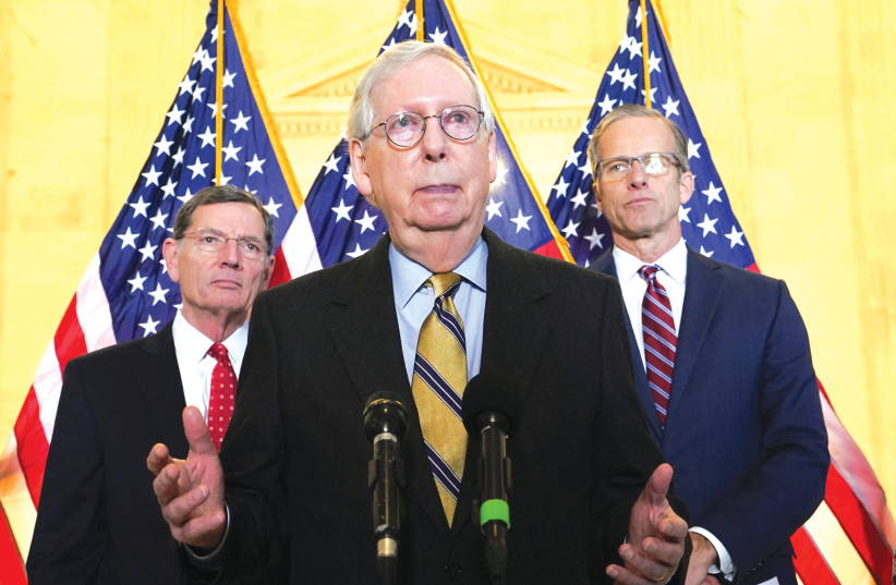  US SENATE MINORITY Leader Mitch McConnell speaks to reporters at the Capitol on Tuesday. (photo credit: KEVIN LAMARQUE/REUTERS)