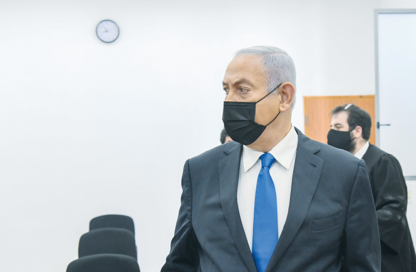  THEN-PRIME MINISTER Benjamin Netanyahu arrives for a hearing in his trial at the Jerusalem District Court last February.  (credit: REUVEN KASTRO/FLASH90)