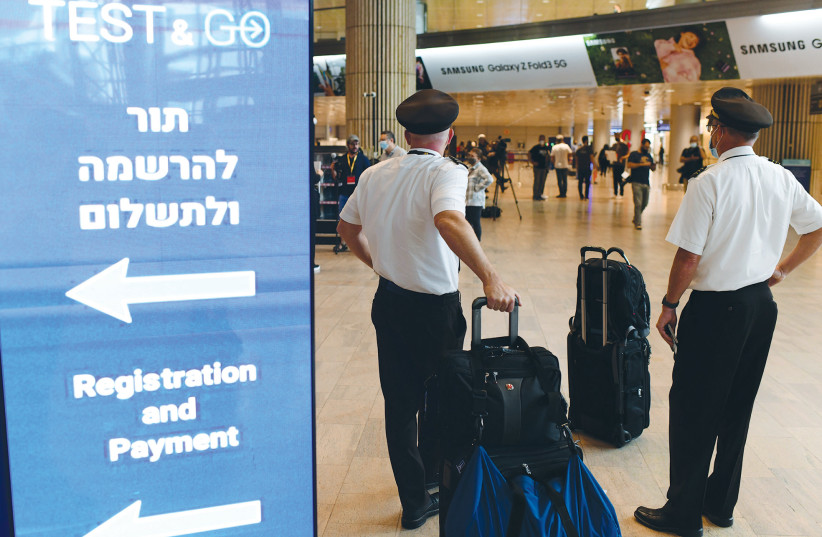 Travelers arrive at Ben-Gurion Airport when Israel again permitted tourists to enter the country on November 1. (photo credit: TOMER NEUBERG/FLASH90)