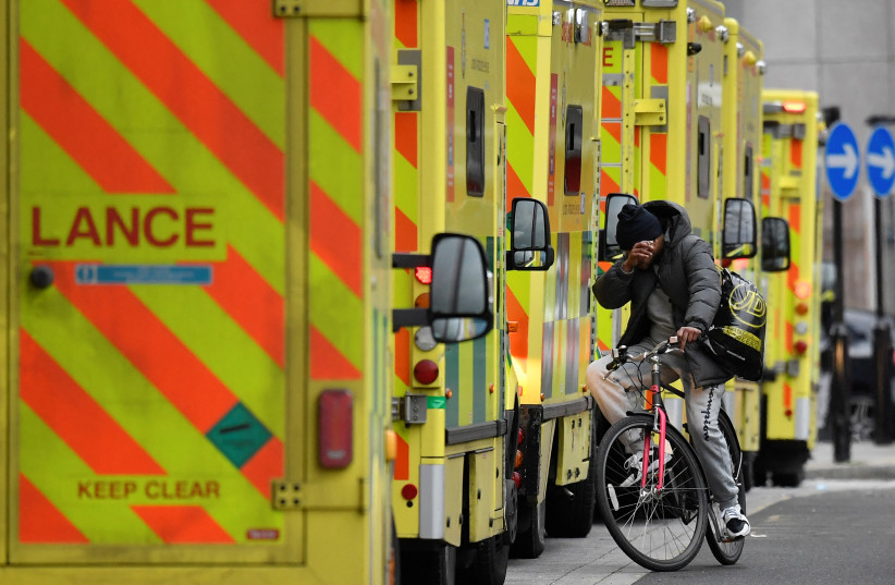  Ambulances parked amid the COVID-19 pandemic outside the Royal London Hospital in London (photo credit: REUTERS/TOBY MELVILLE)
