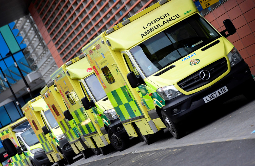   Ambulances parked amid the COVID-19 pandemic outside the Royal London Hospital in London (credit: REUTERS/TOBY MELVILLE)