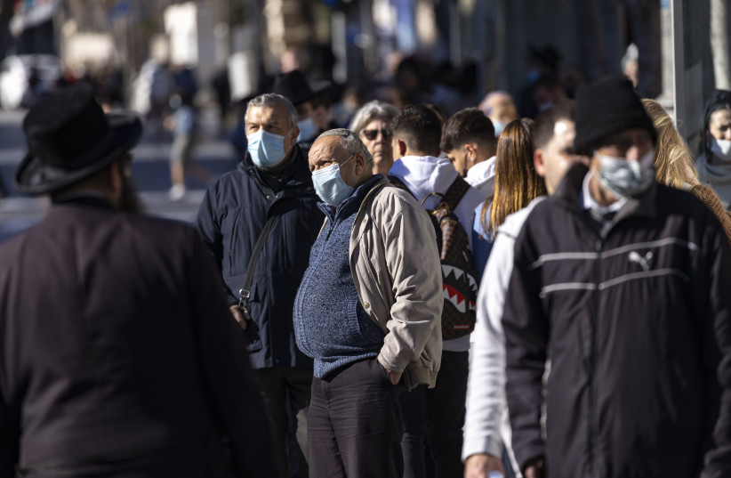  People walk some with face masks on Jaffa Street in Jerusalem January 06, 2022. (photo credit: OLIVIER FITOUSSI/FLASH90)