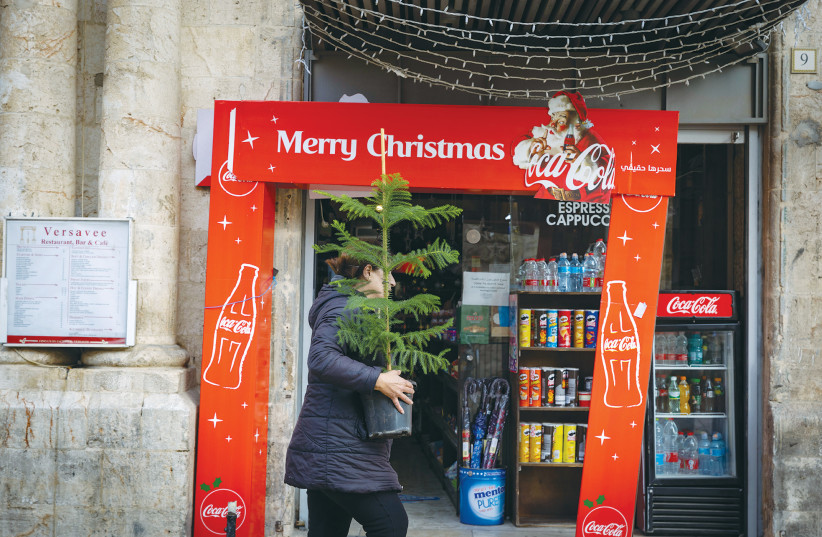 CHRISTMAS SYMBOLS are on display near Jaffa Gate of Jerusalem’s Old City last month. (photo credit: OLIVER FITOUSSI/FLASH90)