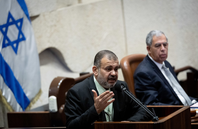  MK Walid Taha speaks during a discussion on the Electricity Law connecting to Arab and Bedouin towns, during a plenum session in the assembly hall of the Israeli parliament in Jerusalem, January 5, 2022.  (photo credit: YONATAN SINDEL/FLASH90)