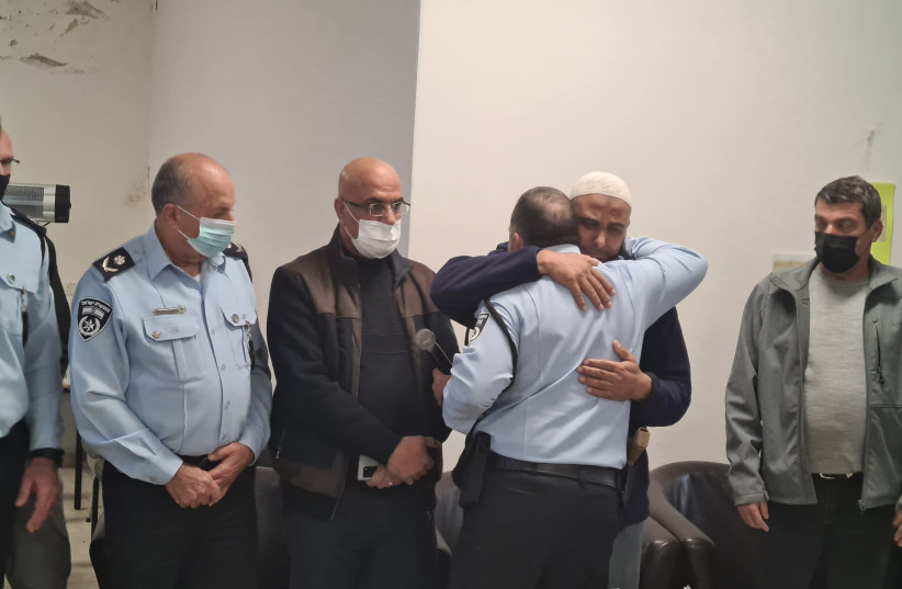 Israel Police chief Kobi Shabtai hugging the father of Omar Hajirat on Saturday, January 8, 2022 (credit: ISRAEL POLICE SPOKESPERSON'S UNIT)