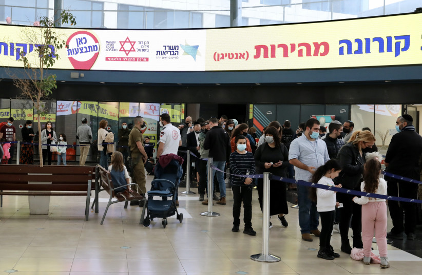  People wait in line for Coronavirus tests at Cinema City, Jerusalem, January 9, 2022 (photo credit: MARC ISRAEL SELLEM/THE JERUSALEM POST)