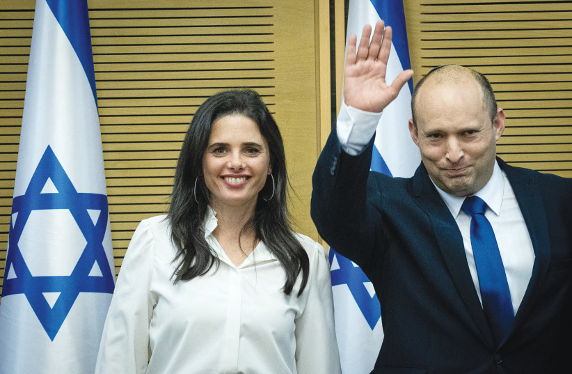  PRIME MINISTER Naftali Bennett, with Interior Minister Ayelet Shaked at his side, waves in the Knesset on June 13, the day the government was inaugurated. (credit: YONATAN SINDEL/FLASH90)