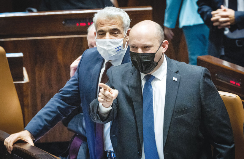  PRIME MINISTER Naftali Bennett gets involved in the sharp debate over the Electricity Law on Wednesday in the Knesset plenum. (photo credit: YONATAN SINDEL/FLASH90)