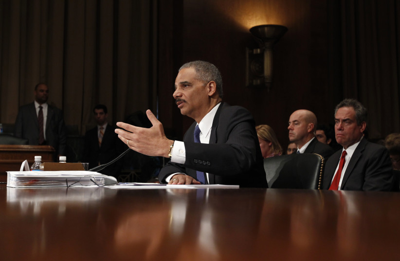 US Attorney General Eric Holder testifies during a hearing on "Oversight of the Justice Department" held by the Senate Judiciary Committee on Capitol Hill in Washington, November 8, 2011. (photo credit: REUTERS/KEVIN LAMARQUE)