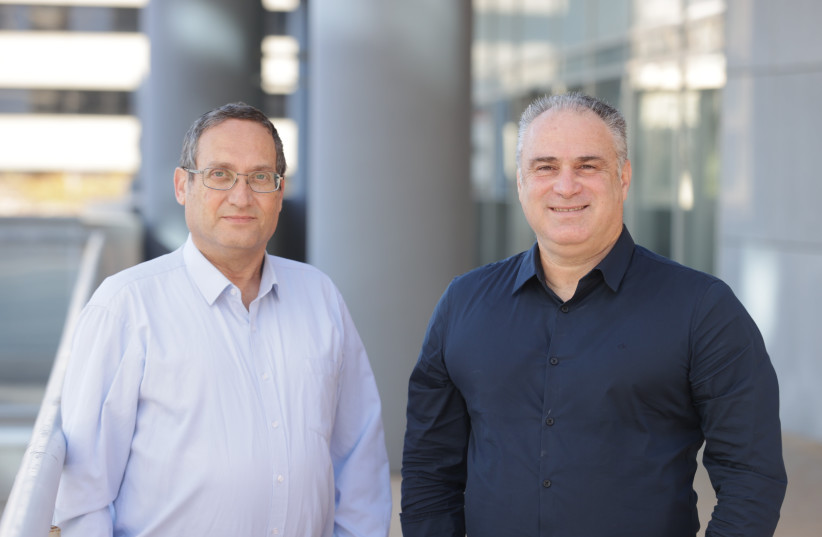 Haim Engler and Addon Optics CEO Amir Erlichman.  (photo credit: Tal Cohen)