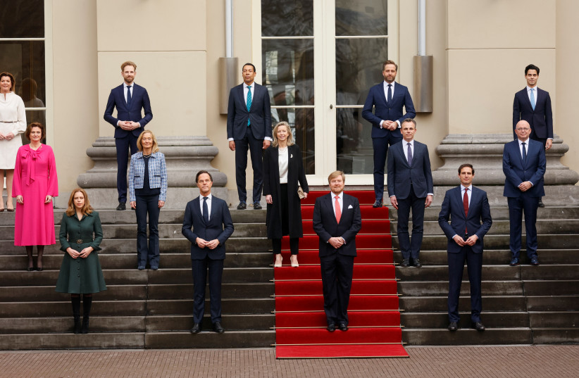  King Willem-Alexander of the Netherlands poses with Prime Minister Mark Rutte and the new members of the Dutch Government at the Noordeinde Palace in The Hague, the Netherlands, January 10, 2022.  (credit: SEM VAN DER WAL/Pool via REUTERS)