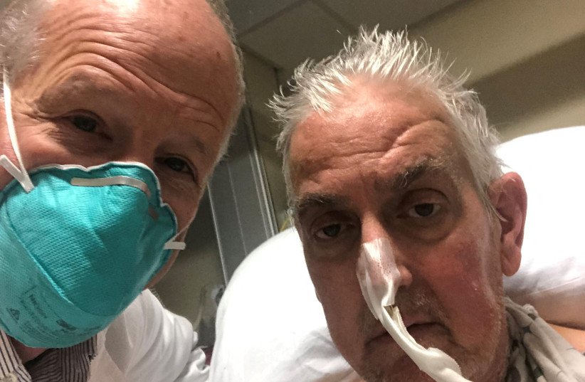  David  Bennett, a 57-year-old patient with terminal heart disease, poses with surgeon Bartley P. Griffith, MD before he received a successful transplant of a genetically-modified pig heart at University of Maryland Medical Center in Baltimore, Maryland. (credit: University of Maryland School of Medicine/handout via REUTERS)
