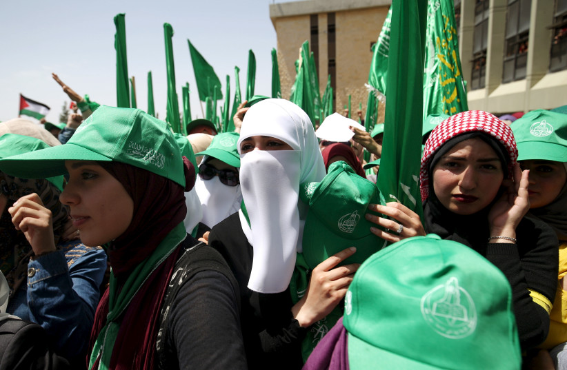  Palestinian students supporting Hamas take part in a rally during an election campaign for the student council at the Birzeit University in the West Bank city of Ramallah April 26, 2016.  (photo credit: MOHAMAD TOROKMAN/REUTERS)
