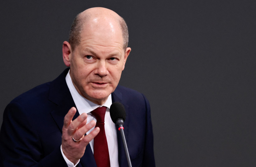 German Chancellor Olaf Scholz speaks during his first questioning session with lawmakers at the lower house of parliament Bundestag in Berlin, Germany, January 12, 2022. (photo credit: REUTERS/HANNIBAL HANSCHKE)