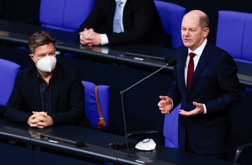 German Chancellor Olaf Scholz, next to German Economy and Climate Protection Minister Robert Habeck, attends his first questioning session with lawmakers at the lower house of parliament Bundestag in Berlin, Germany, January 12, 2022. (credit: REUTERS/HANNIBAL HANSCHKE)