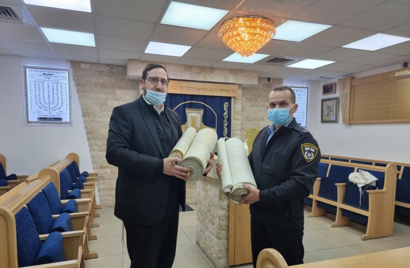   Israel Police return stolen Torah scrolls to Jerusalem synagogue (photo credit: ISRAEL POLICE)