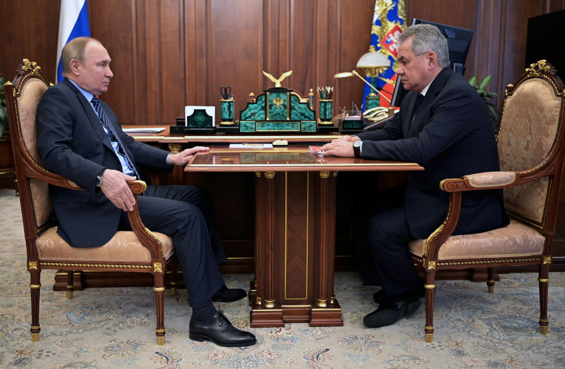 Russia's President Vladimir Putin meets with Defence Minister Sergei Shoigu in Moscow, Russia, January 13, 2022. (credit: SPUTNIK/ALEXEY NIKOLSKY/KREMLIN VIA REUTERS)