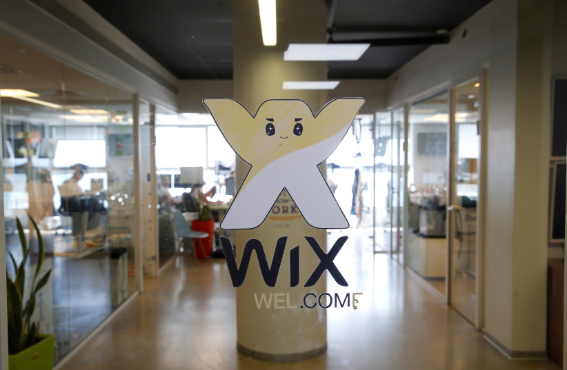  Employees work at website-designer firm Wix.com offices in Tel Aviv. (credit: REUTERS/BAZ RATNER)