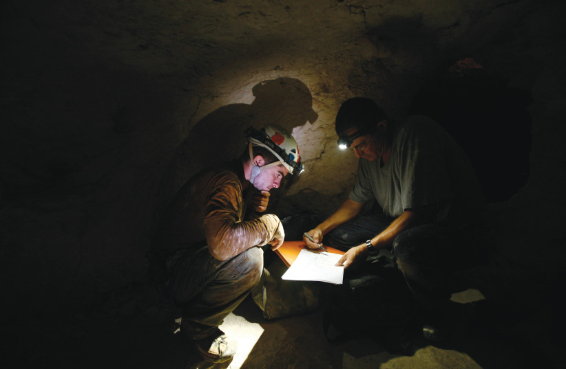  RESEARCHERS INSIDE an archaeological site near Beit Guvrin, 2011. The protagonist-girl goes on an adventurous dig in the area. (photo credit: BAZ RATNER/REUTERS)