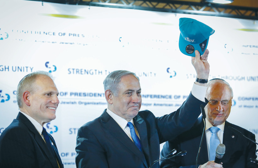 The writer (left) with then-prime minister opposition leader Benjamin Netanyahu at a Conference of Presidents event in Jerusalem in February 2020. (photo credit: OLIVIER FITOUSSI/FLASH90)
