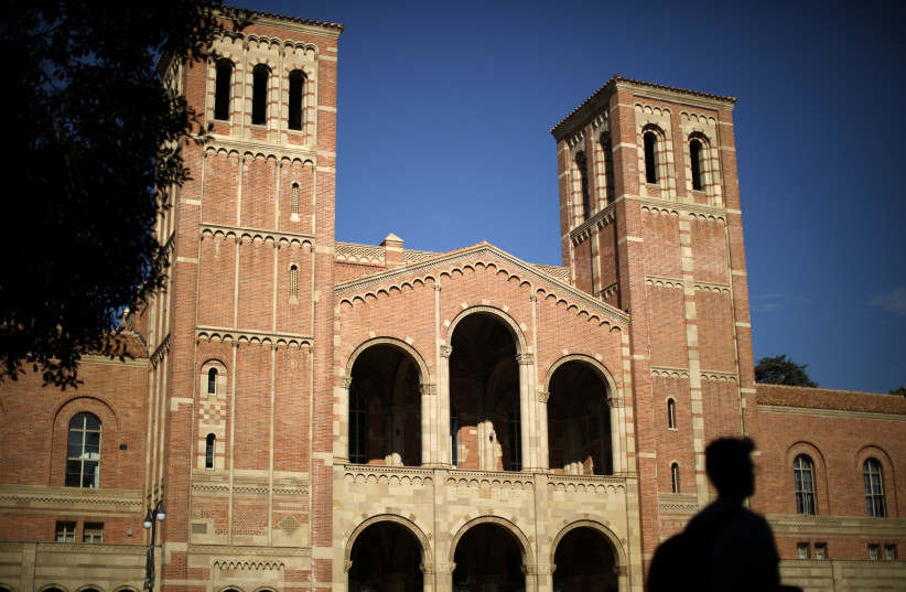 A student walks past Royce Hall on the University of California Los Angeles (UCLA) campus in Los Angeles, California, US, November 15, 2017. (photo credit: REUTERS/LUCY NICHOLSON)