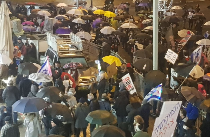  Protests outside A-G Avichai Mandelblit's home as reports come in that he is close to a plea deal with former prime minister Netanyahu, January 15, 2022 (credit: CRIME MINISTER)
