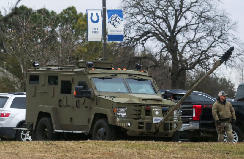 An armored law enforcement vehicle is seen in the area where a man has reportedly taken people hostage at a synagogue during services that were being streamed live, in Colleyville, Texas, US January 15, 2022.  (photo credit: REUTERS/Shelby Tauber)