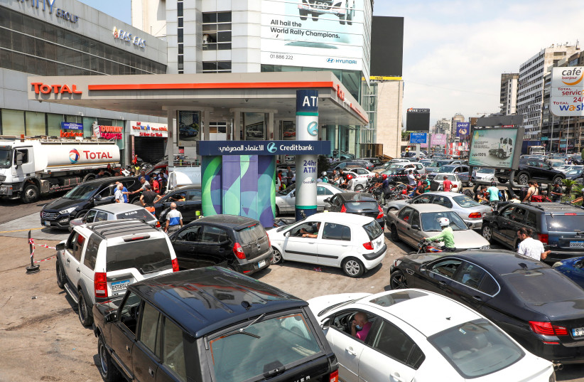 People wait in cars to get fuel at a gas station in Zalka, Lebanon, August 20, 2021. (credit: REUTERS/MOHAMED AZAKIR/FILE PHOTO)