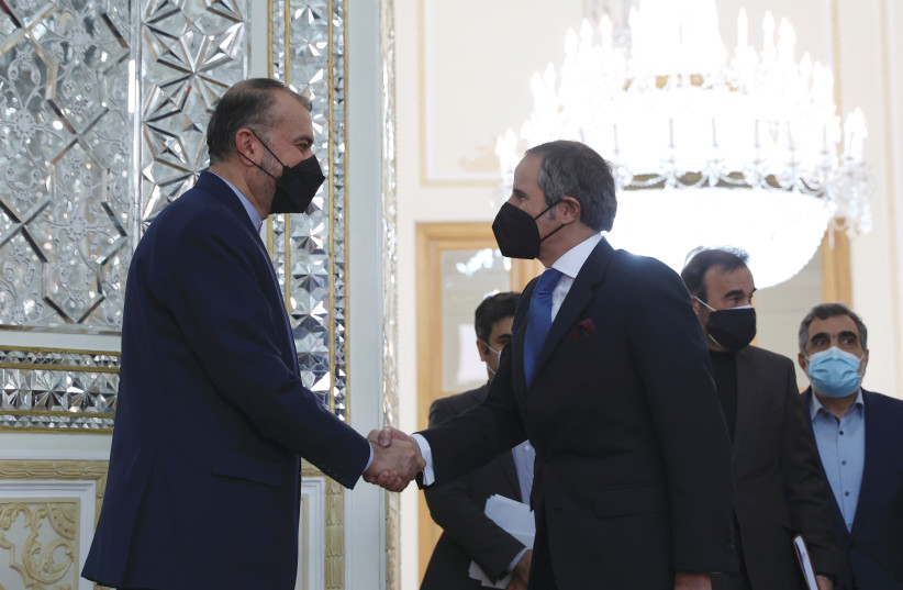  IRAN’S FOREIGN MINISTER Hossein Amirabdollahian (left) meets with International Atomic Energy Agency Director-General Rafael Grossi in Tehran in November. The foreign minister seems to adopt a dual rhetoric when discussing the Vienna talks. (credit: WEST ASIA NEWS AGENCY/REUTERS)