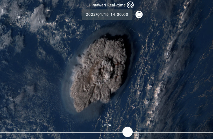 A plume rises over Tonga when the underwater volcano Hunga Tonga-Hunga Ha'apai erupted in this satellite image taken by Himawari-8, a Japanese weather satellite operated by Japan Meteorological Agency, on January 15, 2022 (photo credit: National Institute of Information and Communications Technology (NICT)/Handout via REUTERS)