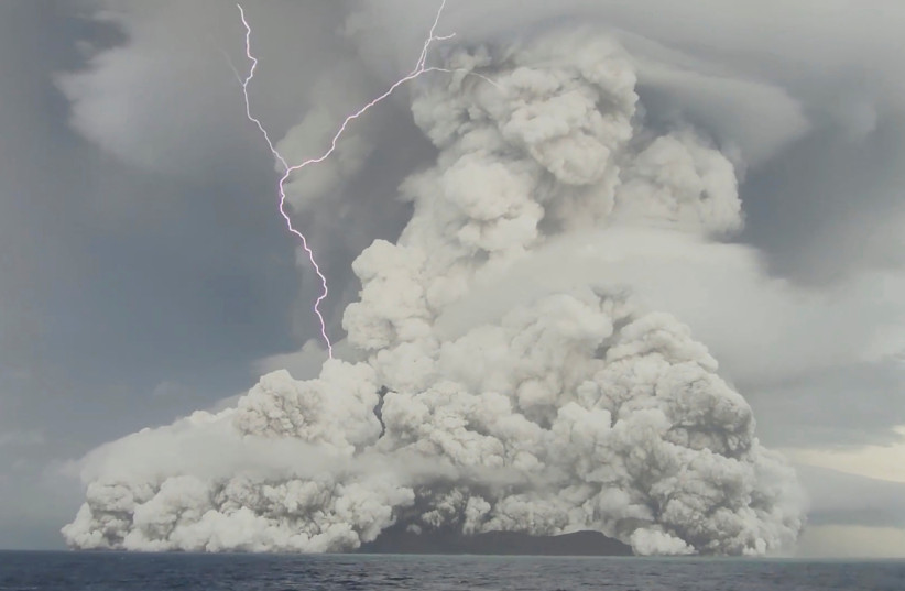 An eruption occurs at the underwater volcano Hunga Tonga-Hunga Ha'apai off Tonga, January 14, 2022, in this screen grab obtained from a social media video. (photo credit: TONGA GEOLOGICAL SERVICES/VIA REUTERS)