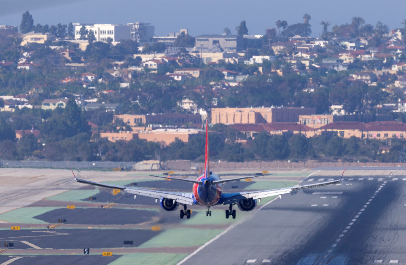 A Southwest Airlines plane approaches to land at San Diego International Airport as US telecom companies, airlines and the FAA continue to discuss the potential impact of 5G wireless services on aircraft electronics in San Diego, California, US, January 6, 2022. (credit: REUTERS/MIKE BLAKE/FILE PHOTO)