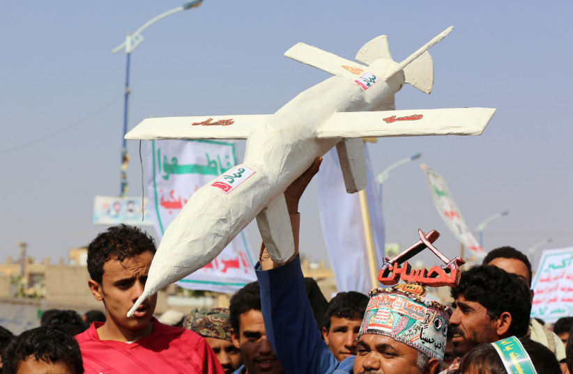 Followers of the Houthi movement carry a mock drone during a rally held to mark the Ashura in Saada, Yemen, September 10, 2019. (credit: REUTERS/NAIF RAHMA)