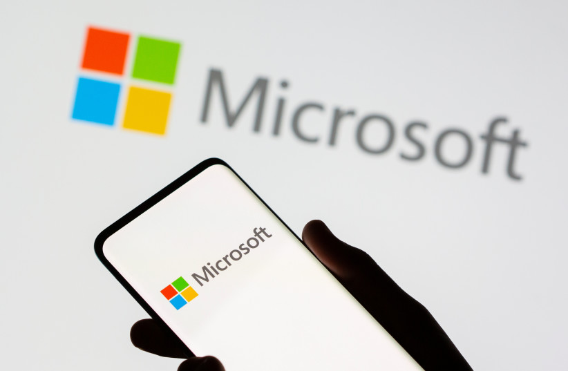  Smartphone is seen in front of Microsoft logo displayed in this illustration taken, July 26, 2021. (photo credit: DADO RUVIC/REUTERS)