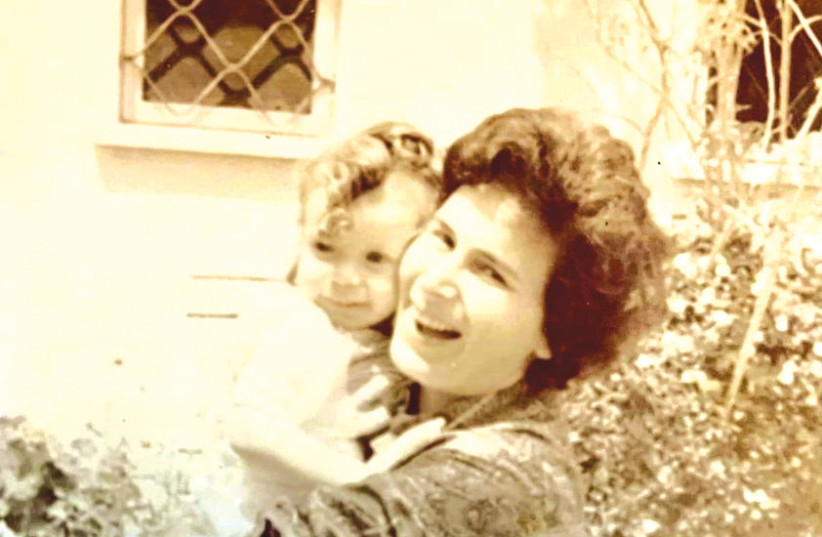  PRESIDENT ISAAC HERZOG as a baby in the arms of his mother Aura. (credit: HERZOG FAMILY)