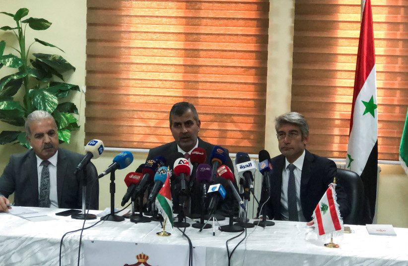  Syrian Electricity Minister Ghassan al-Zamil attends a news conference with Jordan's Minister of Energy and Mineral Resources Saleh Ali Hamed Al-Kharabsheh and Lebanon's Energy Minister Walid Fayad in Amman, Jordan October 28, 2021. (photo credit: REUTERS/JEHAD SHELBAK)