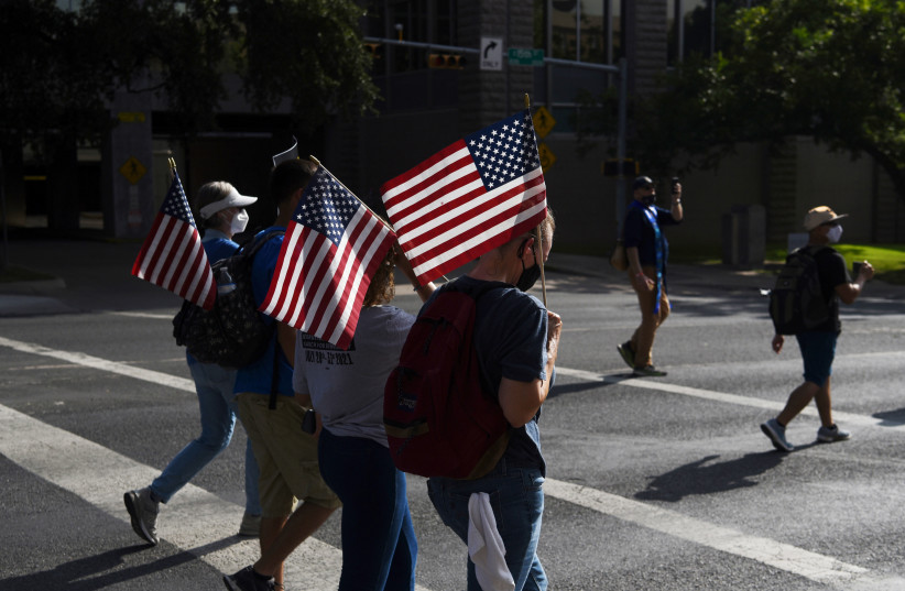  Protesters take part in a march for voting rights and against the state's efforts to enact voting restrictions in Austin, Texas, US, July 31, 2021. (credit: CALLAGHAN O'HARE/REUTERS)