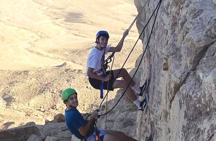  The writer’s nephew, Noam Spevack (top), climbs with a counselor on the USY Pilgrimage this past summer. (photo credit: Jeremy Malaga)